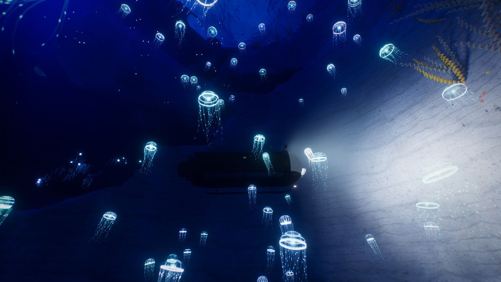 Des méduses lumineuses autour du sous-marin, dans le noir